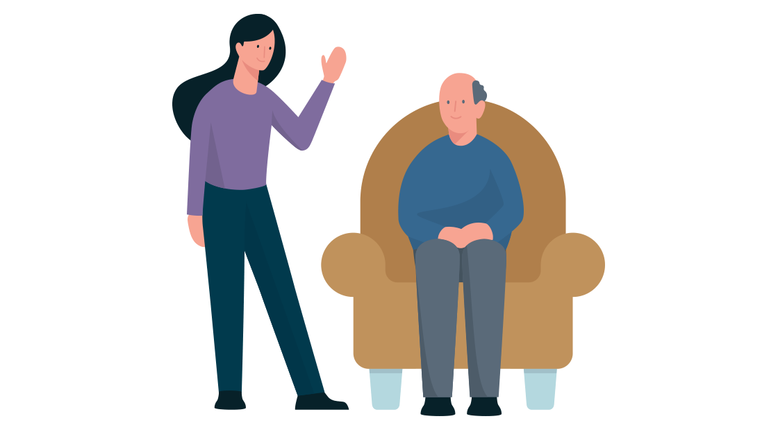 een oudere man zit in een fauteuil en links van hem staat een vrouw te zwaaien